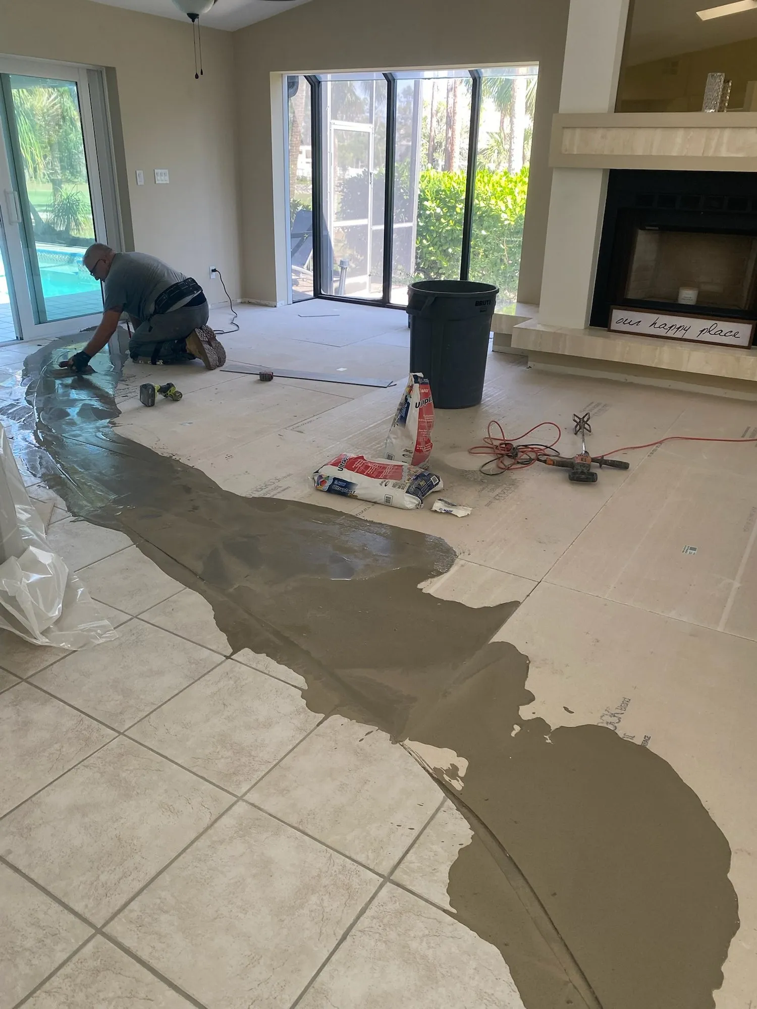 Self-leveling compound poured over the slab where tile was removed