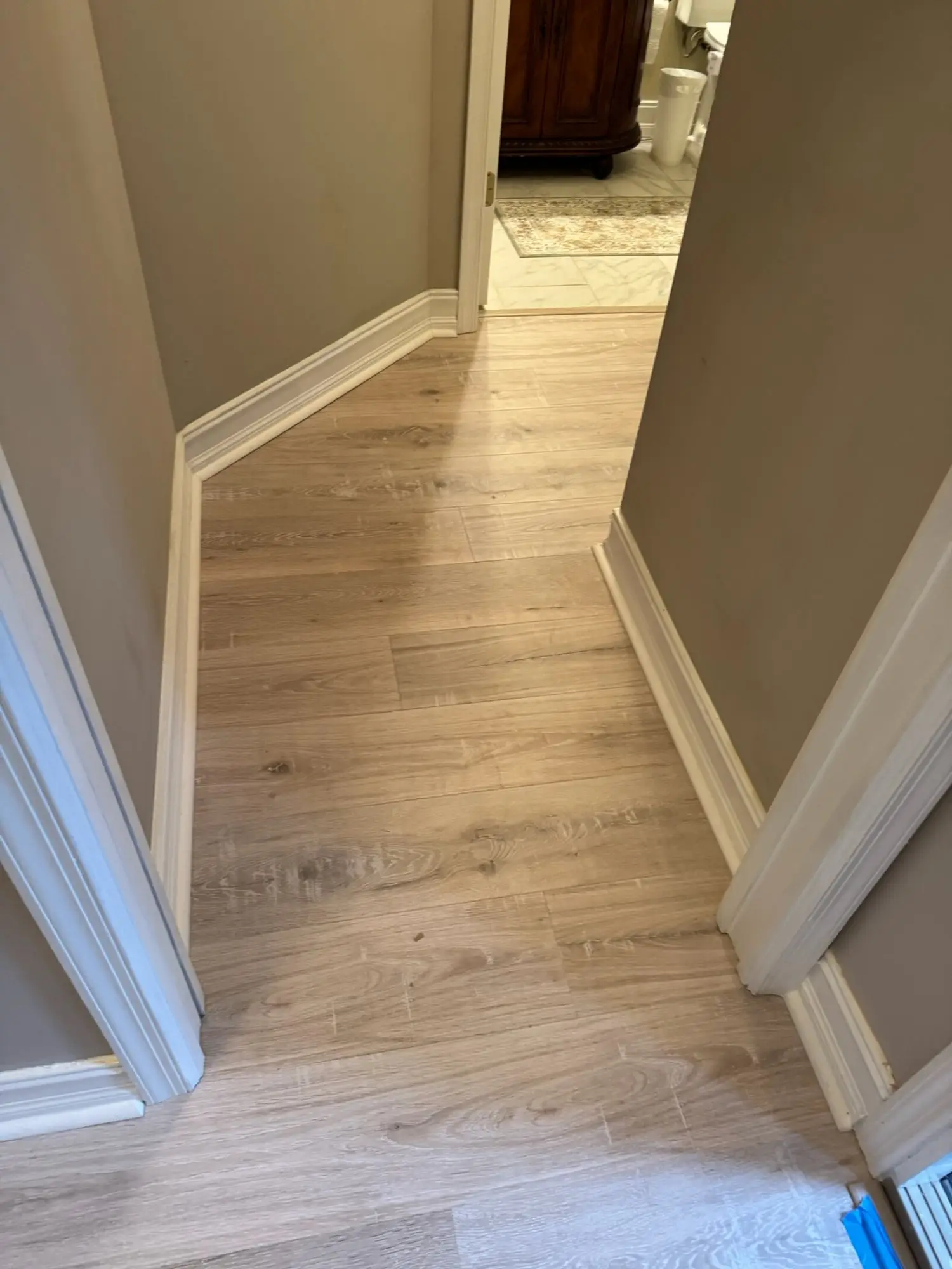 Light oak plank through an open floor plan