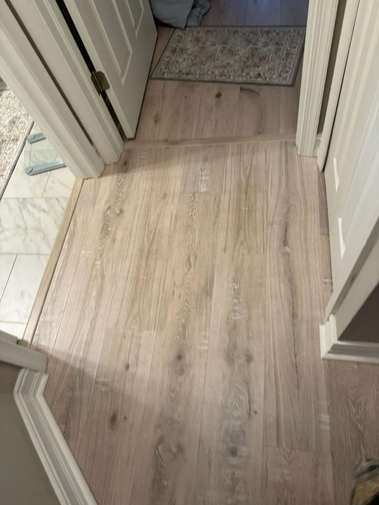 Light oak plank through an open floor plan