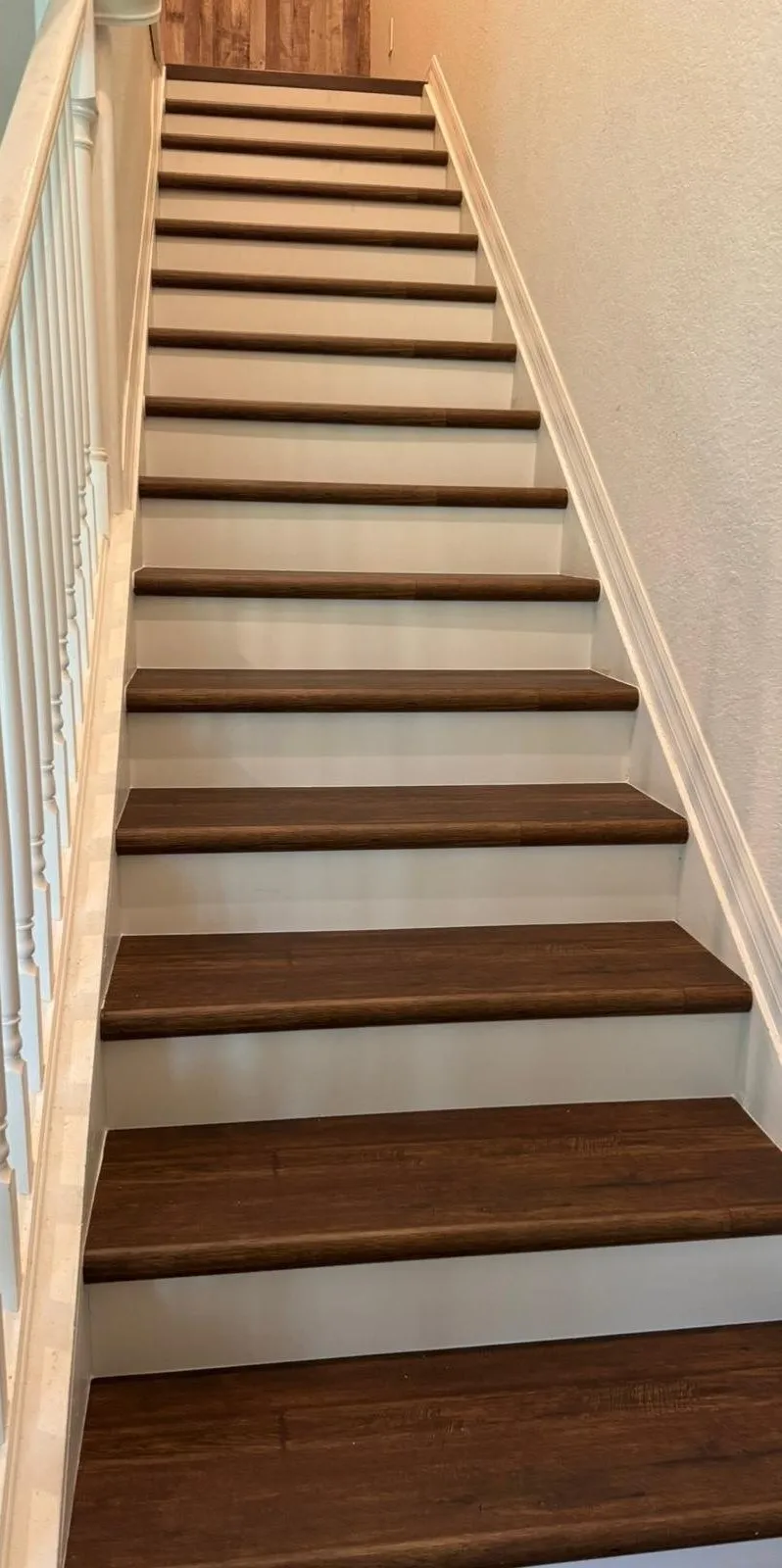 Landing and full flight with walnut vinyl treads and white risers
